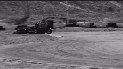 Black and white GIF of FSAE car racing on track